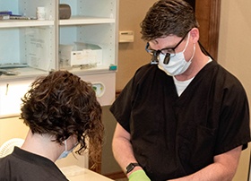 Dr. Lively and team member treating dental patient