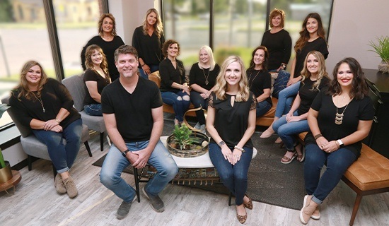 333 Dental Care team members posing at sign