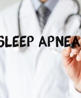 Medical professional using marker to write “sleep apnea”
