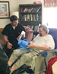 Dr. Lively talking to man at community event