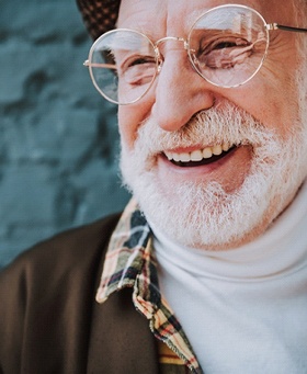 An older man smiling