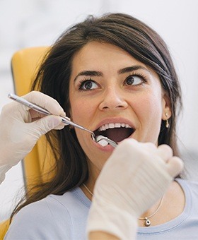 Woman receiving dental treatment