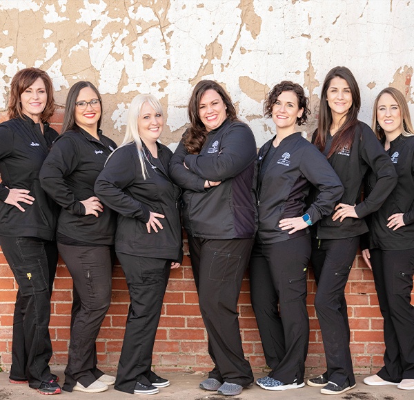 The 333 Dental Care team members smiling in black scrubs