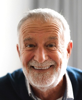 Senior man smiling with implant dentures in Mangum, OK