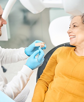 Woman seeing a dentist about tooth replacement