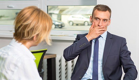 Man covering his mouth