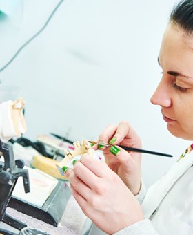 An individual working in a lab to create customized appliance
