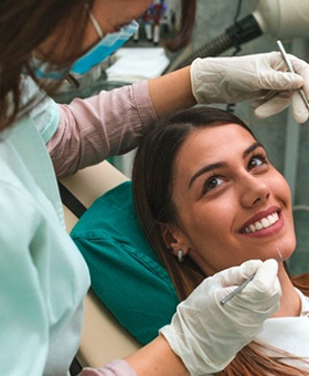 A young woman undergoing a regular dental checkup and cleaning