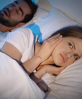 Snoring man and wife