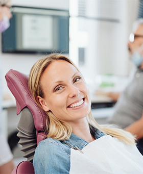  Woman smiling at dentist in Mangum