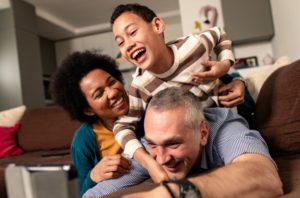 a family having fun together after visiting their Elk City Dentist