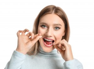 Woman flossing